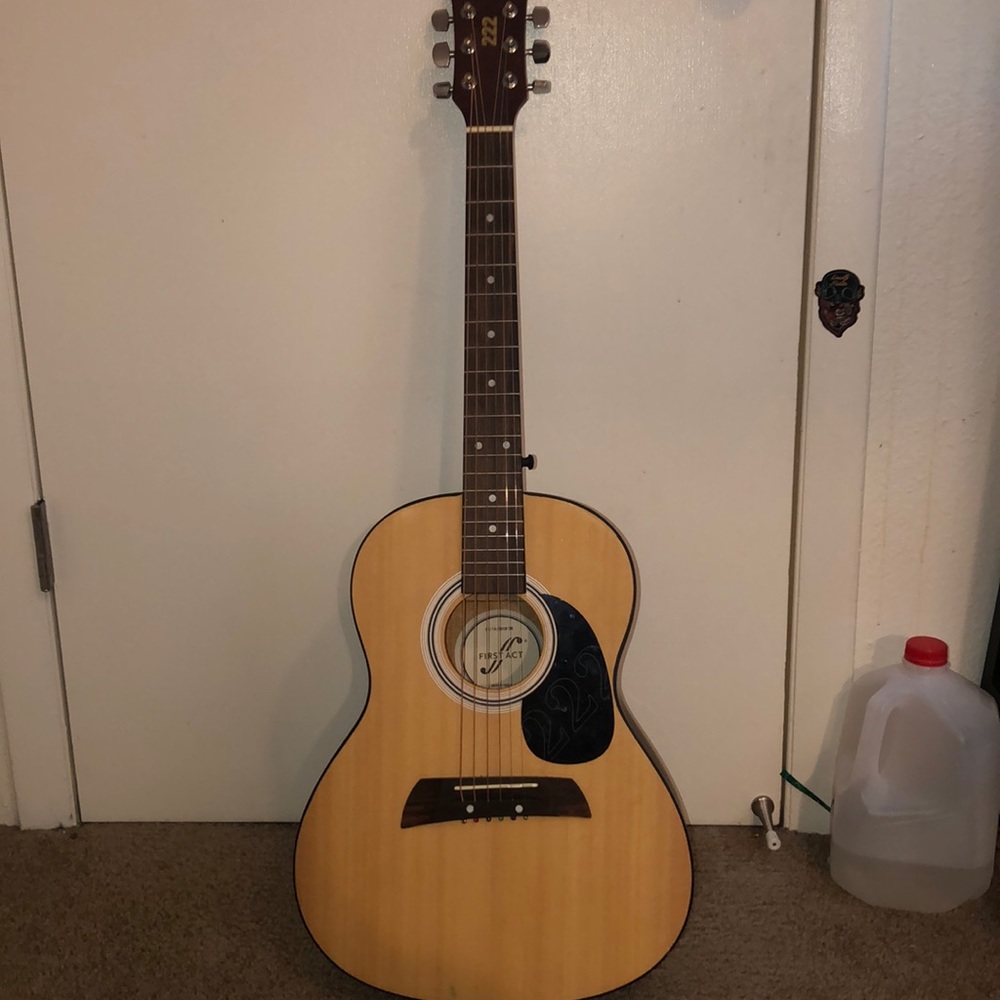 Guitar, first act,and it says 222 on it.